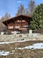 wooden house, stone wall, balcony, snowy ground