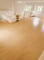 empty room, wooden floor, fireplace, couch, white walls