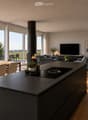 Open-plan living and dining area with modern furniture, large windows offering a scenic view, a central kitchen island, and a fireplace.