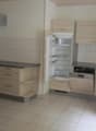 Wood cabinets, tile floor, refrigerator with freezer, dishwasher, gas stove, electric oven, wooden counter top