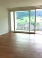 empty room, wooden floor, sliding glass doors, balcony, mountain view