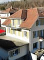 two story house with two balconies
