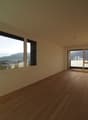 large windows, balcony, wooden floor, sliding glass doors