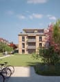 modern apartment buildings, balconies, landscaped area, bicycles, well-maintained garden