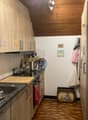 kitchen, wooden cabinets, countertops, gas stove, sink, dishwasher, kettle, chopping board, various cookware, cabinets on the wall