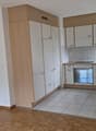 modern kitchen with wooden cabinets, tiled flooring, dishwasher, washing machine, gas stove, sink, modern appliances