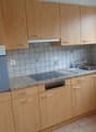 light wood cabinets, gas stove, electric oven, sink, dishwasher, window