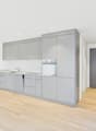 modern kitchen with integrated oven and sink, gray cabinetry, wooden floors, spacious, no appliances seen
