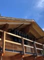 wooden chalet, balcony, wooden roofing, hanging bells