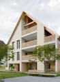 3-story apartment building with a modern, minimalist design. The building features a mix of concrete and wood materials, with large balconies on each floor. The building is surrounded by greenery and has a paved walkway in the front.