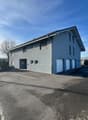 grey exterior, large windows, 3 garages, large parking space