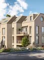 3 story house, beige exterior, multiple windows, balconies, circular window on the front