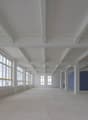Empty room with white walls, white ceiling, glass windows, industrial style