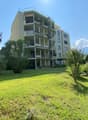 multistory building, balconies, garden, trees, grass, blue sky