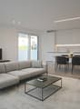 modern living room, L-shaped sofa, coffee table, leather armchair, television, dining table, white cabinetry, flower on table, carpet