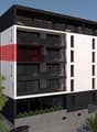 5-story modern apartment building with a mix of black, white, and red exterior colors, balconies on each floor, and landscaping around the building.