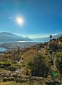 hillside view, houses, mountains, lake, clear sky, sun