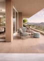 modern balcony with wooden floor, glass walls, outdoor furniture, dining table, view of mountains and lake