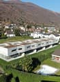 Modern apartment building, several units, swimming pool, greenery, mountainous landscape