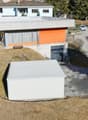 Modern style house, gray roof, orange part, 2 stories, garage