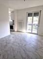 Empty room, marble flooring, white walls, sliding glass door, balcony
