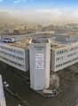 The image shows a large multi-story office building complex called Sternen Hof, with several interconnected buildings and a central tower structure. The buildings have flat roofs with greenery on top, likely serving as green roofs. The complex appears to