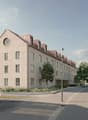 Apartment building, white exterior, brown roof, many windows, balcony on the first floor, streetlight, bushes, empty road
