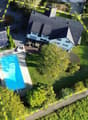 detached house, modern design, swimming pool, solar panels, paved driveway, trees, lawn