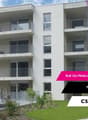 4-story apartment building with balconies, white exterior, large windows, located on Rue du Praillon in Martigny