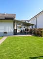 Rückansicht mit Garten und Platz zum Spielen