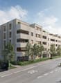 Modern apartment building with multiple balconies and terraces, located on a street with greenery and streetlights