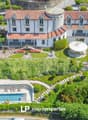 large villa, 2 story, red roof, white walls, pool, terrace, garden, car park, gazebo