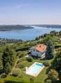 2 story house, surrounded by garden, with swimming pool, view over lake and mountains