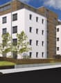5-story building, white walls, brown wooden accents, balconies, windows, ground-level fencing