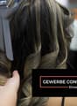 Hair being styled with a curling iron