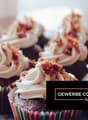 cupcakes topped with whipped cream and bacon bits