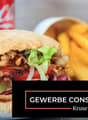 Sandwich with lettuce, tomato, onion, and meat, french fries, Coca-Cola