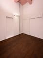 empty room, hardwood floors, pink painted ceiling, recessed lighting, two large doors