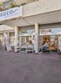 Buch paradies retail store with outdoor seating area, displays of books and other merchandise in the storefront windows