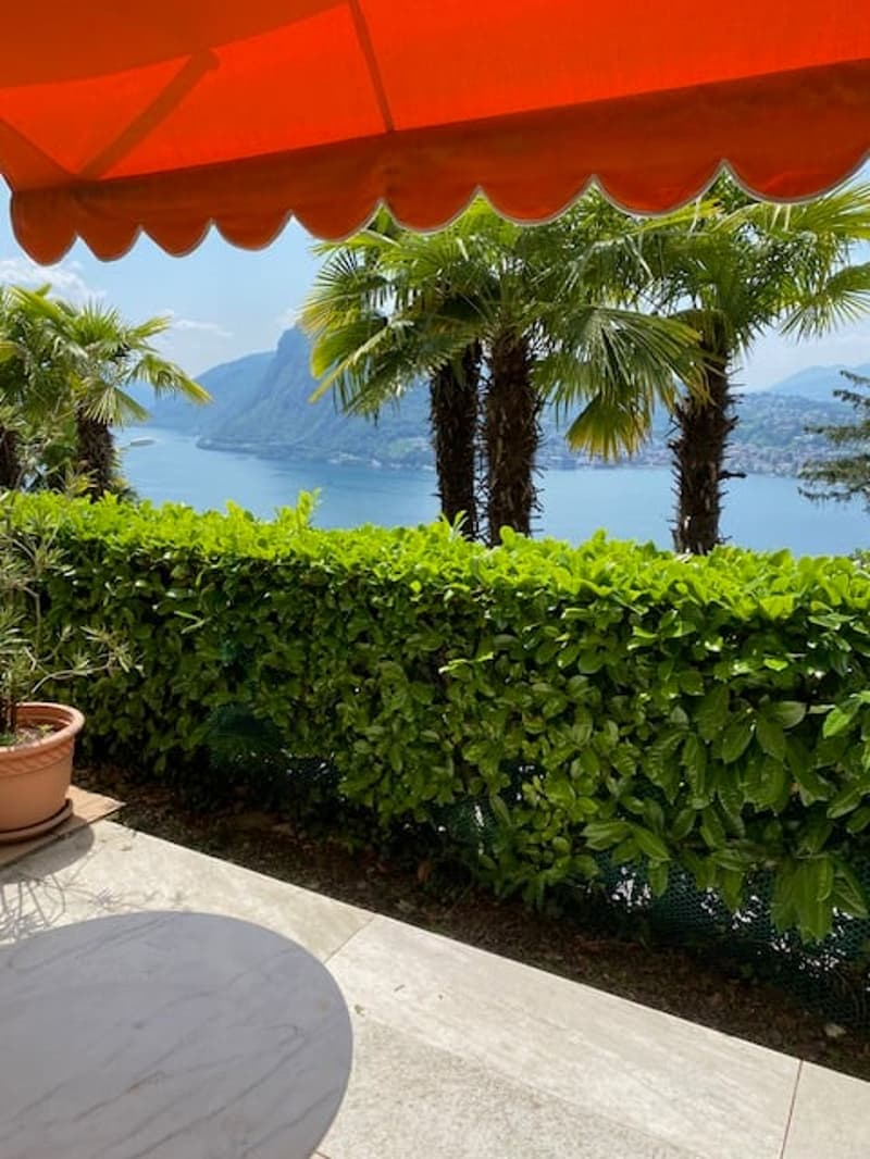 Ruvigliana vendiamo appartamento al piano terra con terrazza/giardino vista lago (1)