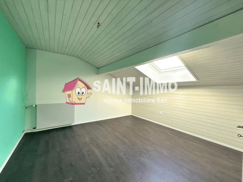 empty room, green wall, wooden wall, wooden floor, radiator, skylight