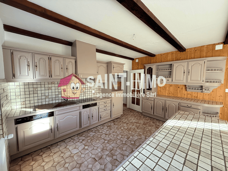 white kitchen with tiled flooring, tiled backsplash, built-in cabinets, a wooden beam ceiling, gas stove, dishwasher, and a large island