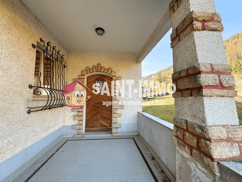 Stone wall, wooden door, balcony, tiled floor