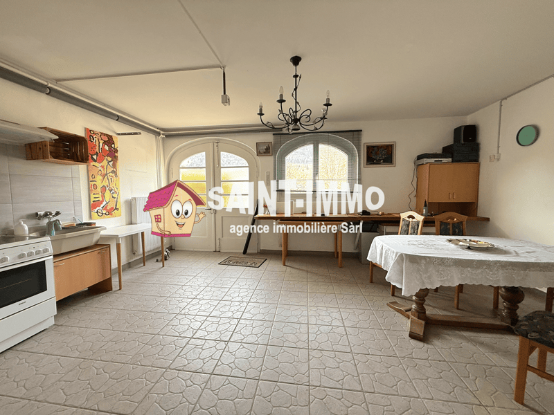 kitchen with white appliances, dining table, chairs, wooden cabinets, chandelier, windows, paintings