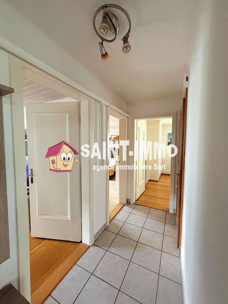 tiled floor, white walls, wooden floor, white doors, ceiling light