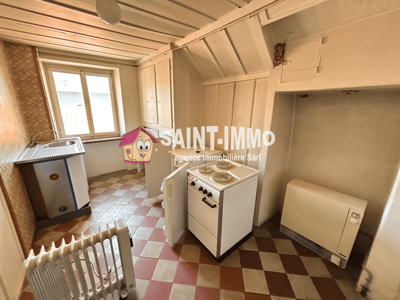 Immeuble locatif à réhabiliter de 4 appartements, un local, une parcelle constructible et un garage (14)