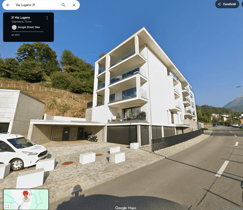 Modern white building, multiple balconies, underground parking, modern design, multiple floors