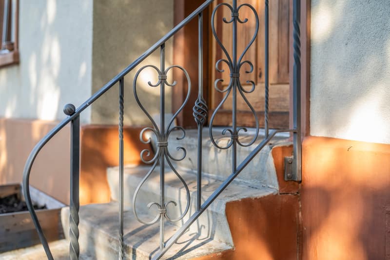 Stairs with wrought iron railing, 4 steps