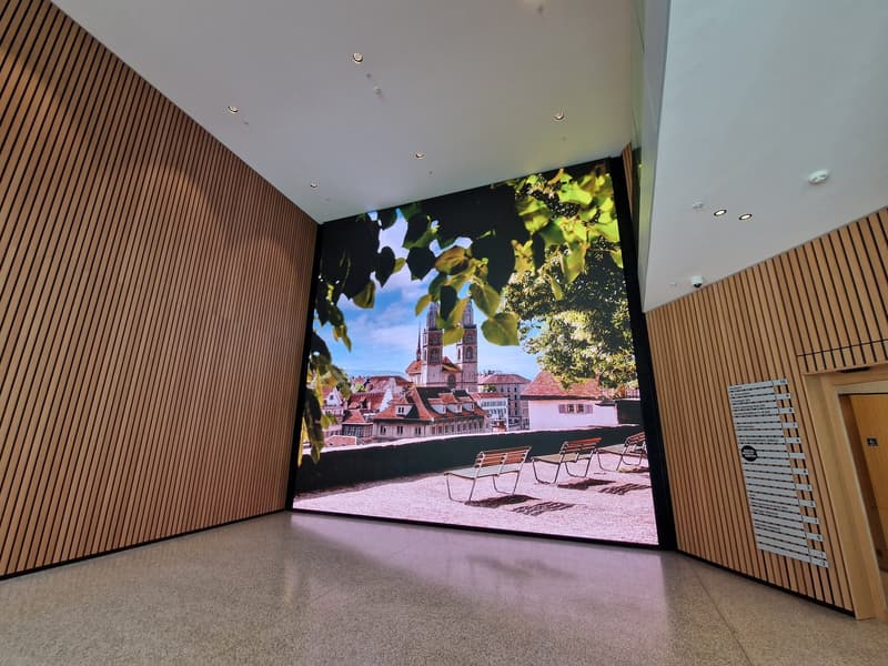 wooden walls, large screen with outdoor view, tiled floor, modern design