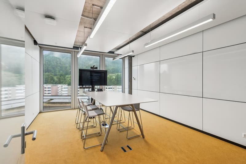 empty meeting room, yellow floor, modern furniture, large windows, modern technology
